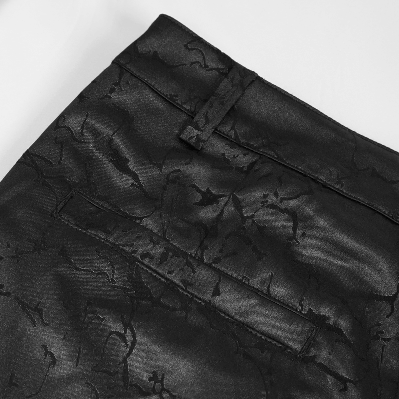 Close-up of black gothic vintage pants showcasing intricate texture and stitching details.