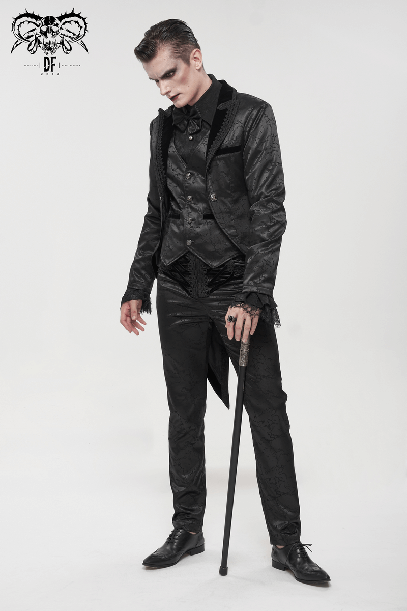Stylish man in black gothic outfit with cane, showcasing vintage elegance and slim-fit design.