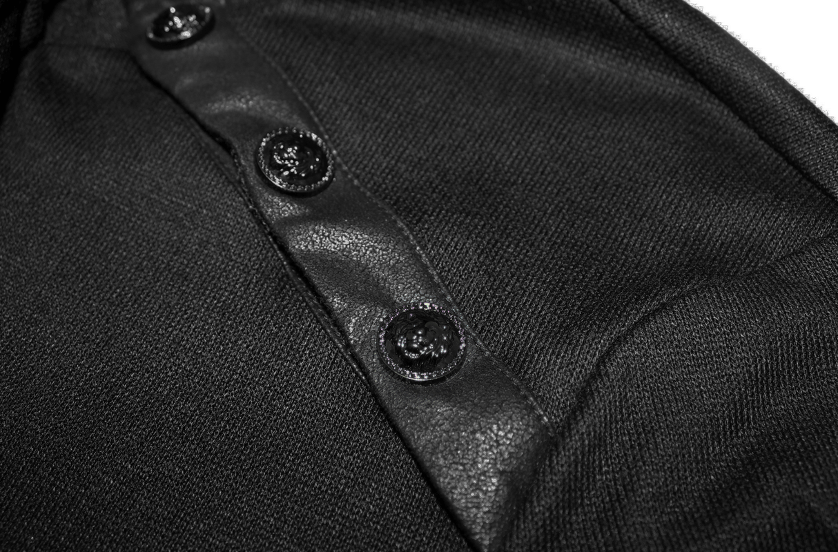 Close-up of black sweatshirt buttons highlighting punk gothic style and soft fabric texture.
