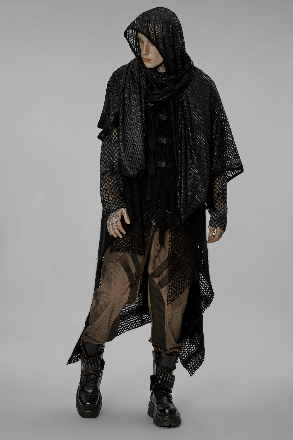 Black mesh hooded scarf worn as a unique post-apocalyptic fashion statement with edgy layering and dynamic styling.