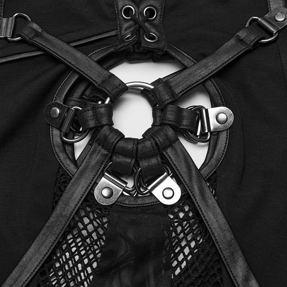 Close-up of black mesh inlay with metallic ring detail on gothic-style skinny pants, showcasing unique edgy design.