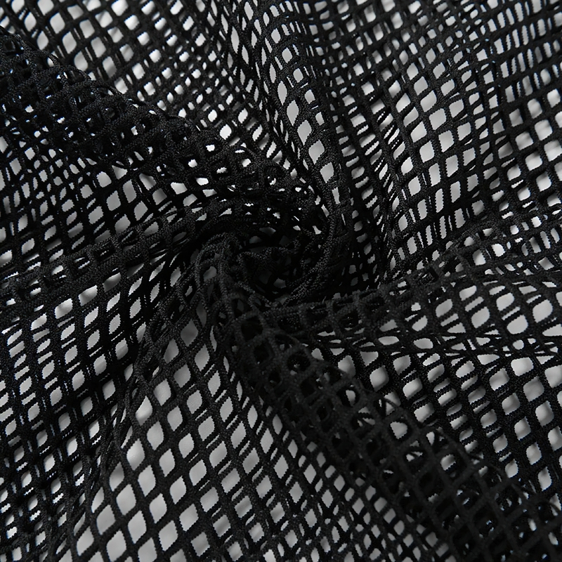 Close-up of black mesh fabric showcasing its lightweight and breathable texture for women's crop tops.