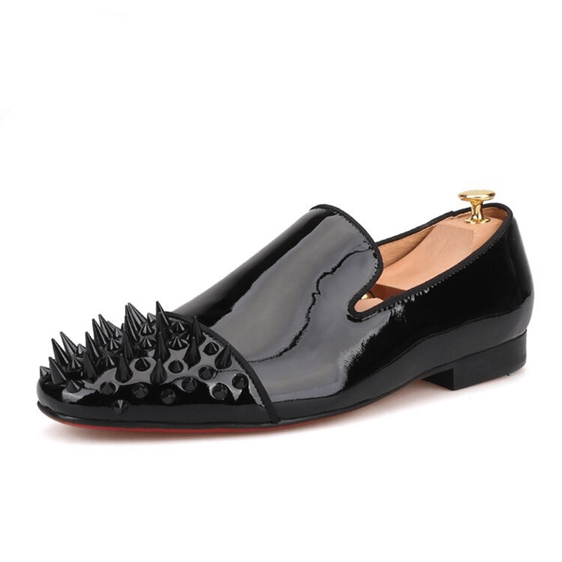 Stylish black patent leather men's loafers with spikes on toe, perfect for casual or fashion-forward outfits.