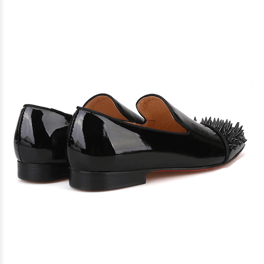 Stylish black patent leather men's loafers with spikes on toe, perfect for casual fashion looks.