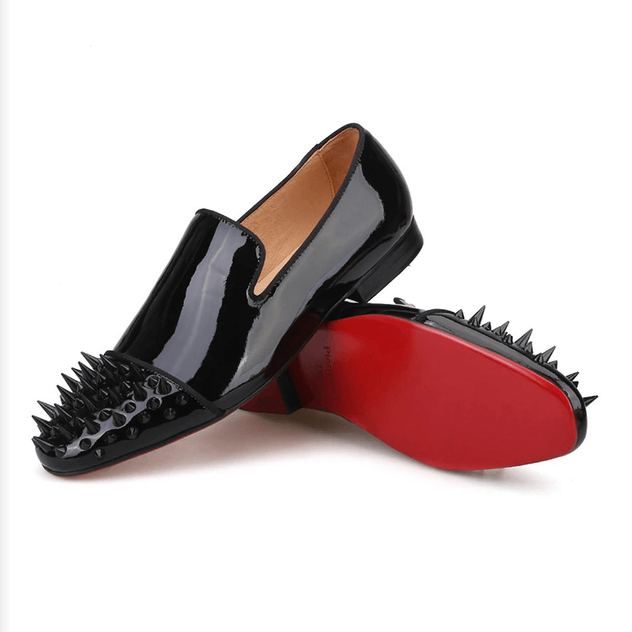 Black patent leather men's loafers with spikes on toe, stylish fashion casual shoes for men.