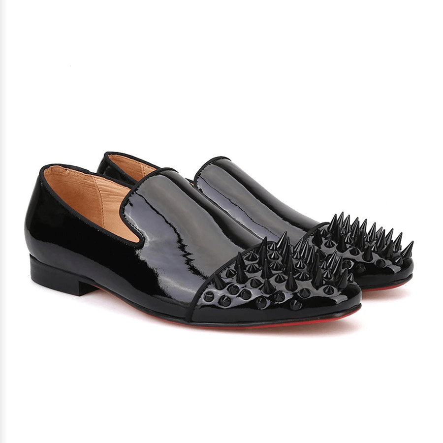 Black patent leather men's loafers with spikes on toe for a stylish and edgy look.