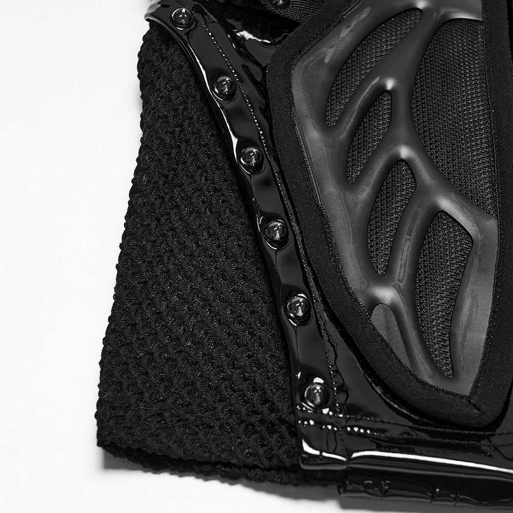 Close-up of the Black Patent Leather Techwear Mini Skirt with Buckles showcasing rubber panels and shiny details.