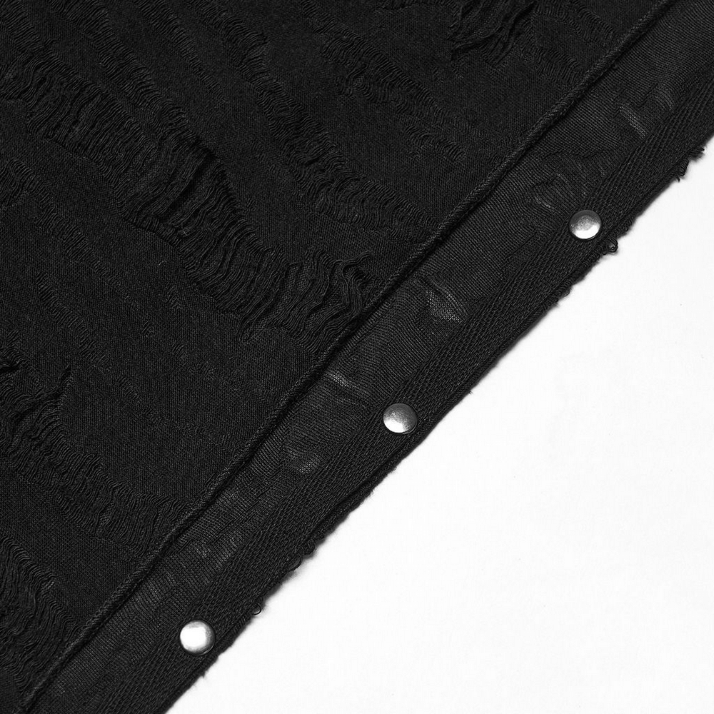Close-up of a black punk bandana featuring tattered knitted fabric and metallic studs for a rebellious touch.