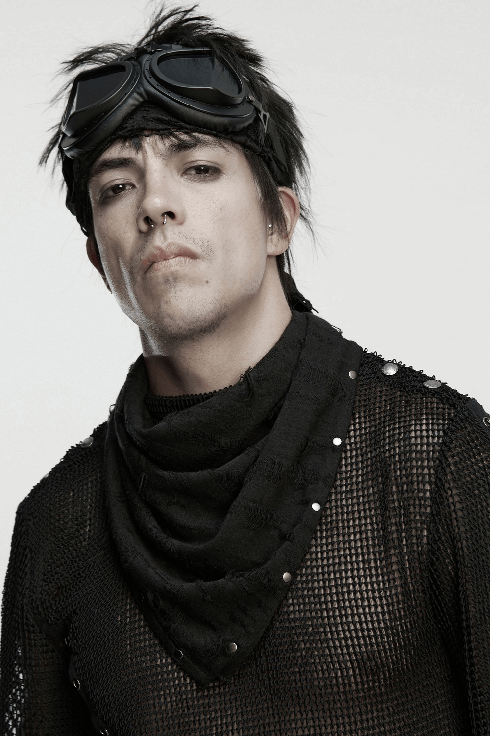 Punk model wearing a black bandana with studs, showcasing an edgy fashion statement with a rebellious look.