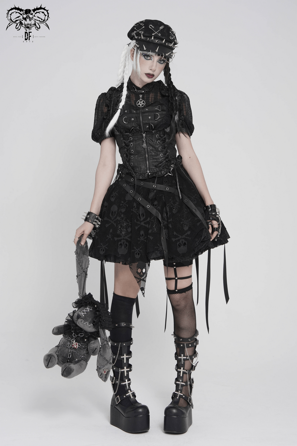 Black Punk Beret Hat with Spikes Rings and Safety Pin Trim worn with a gothic outfit featuring skulls and edgy accessories.