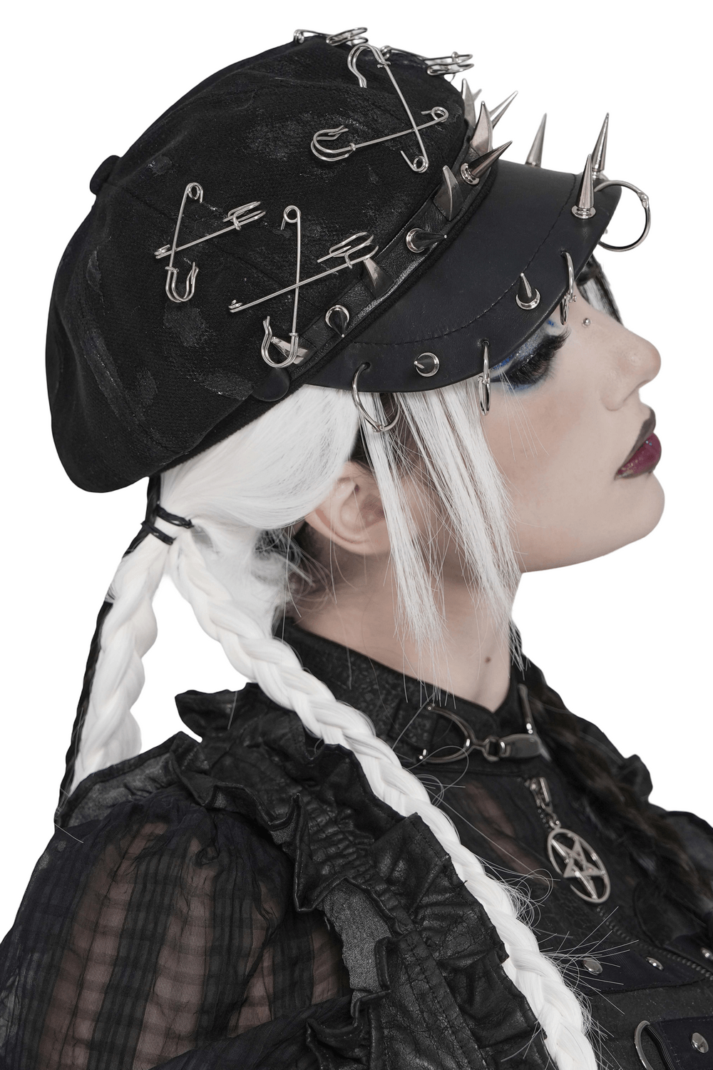 Black Punk Beret Hat with Spikes Rings and Safety Pin Trim worn by model showcasing gothic style and edgy details.