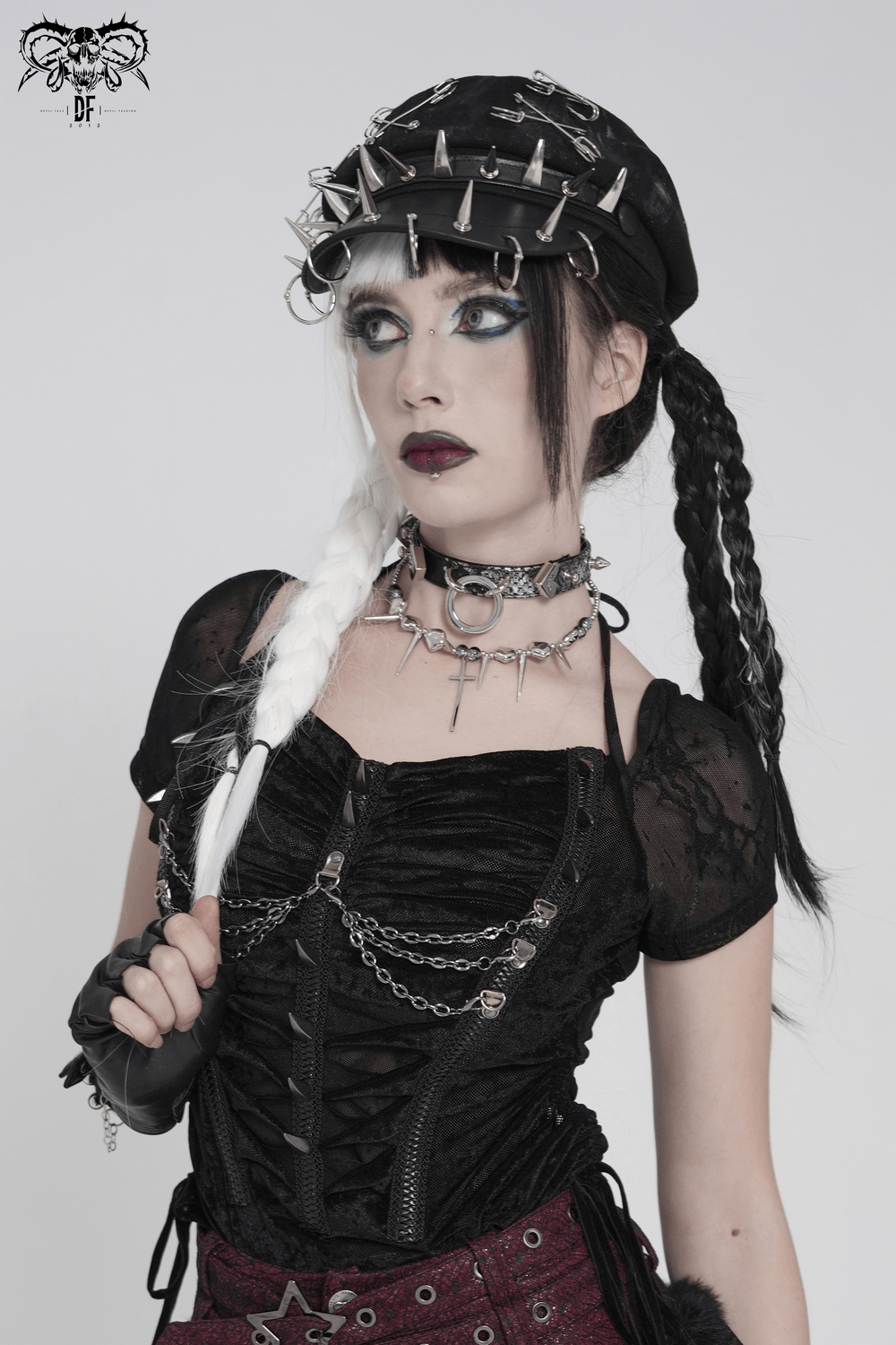 Black Punk Beret Hat with Spikes Rings and Safety Pin Trim worn by model featuring gothic style outfit and fierce accessories.