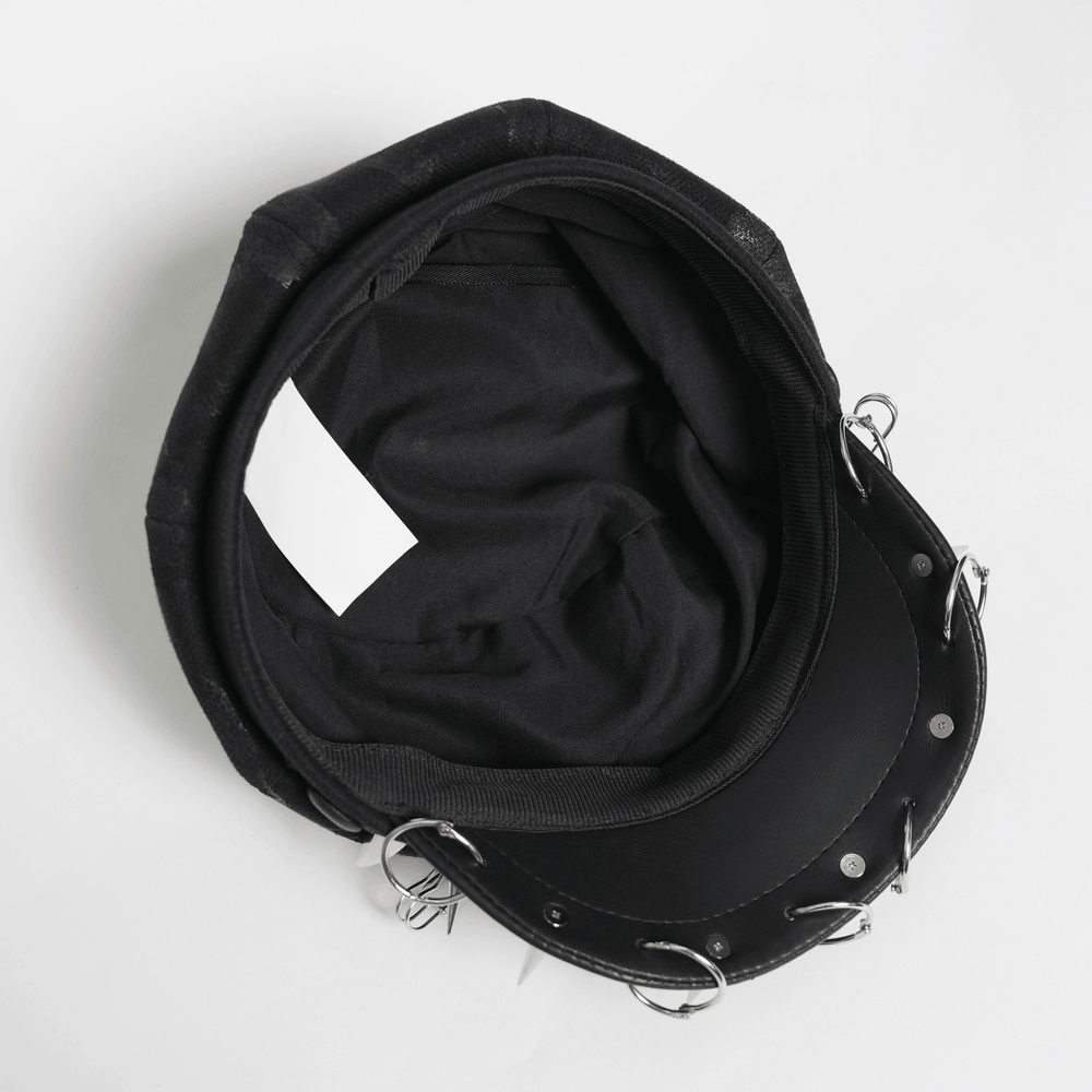 Black Punk Beret Hat with Spikes Rings and Safety Pin Trim - inside view showcasing metal rings and black fabric.