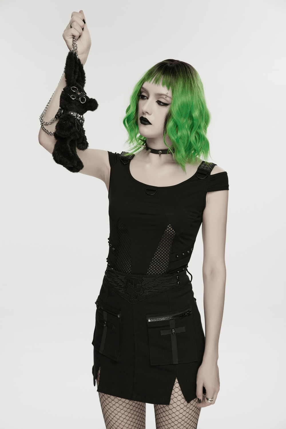 Alt Tag: Black Punk Bunny Plush Keychain Bag Charm Doll in goth bunny plush with chains and lobster clasp, held by model in black outfit