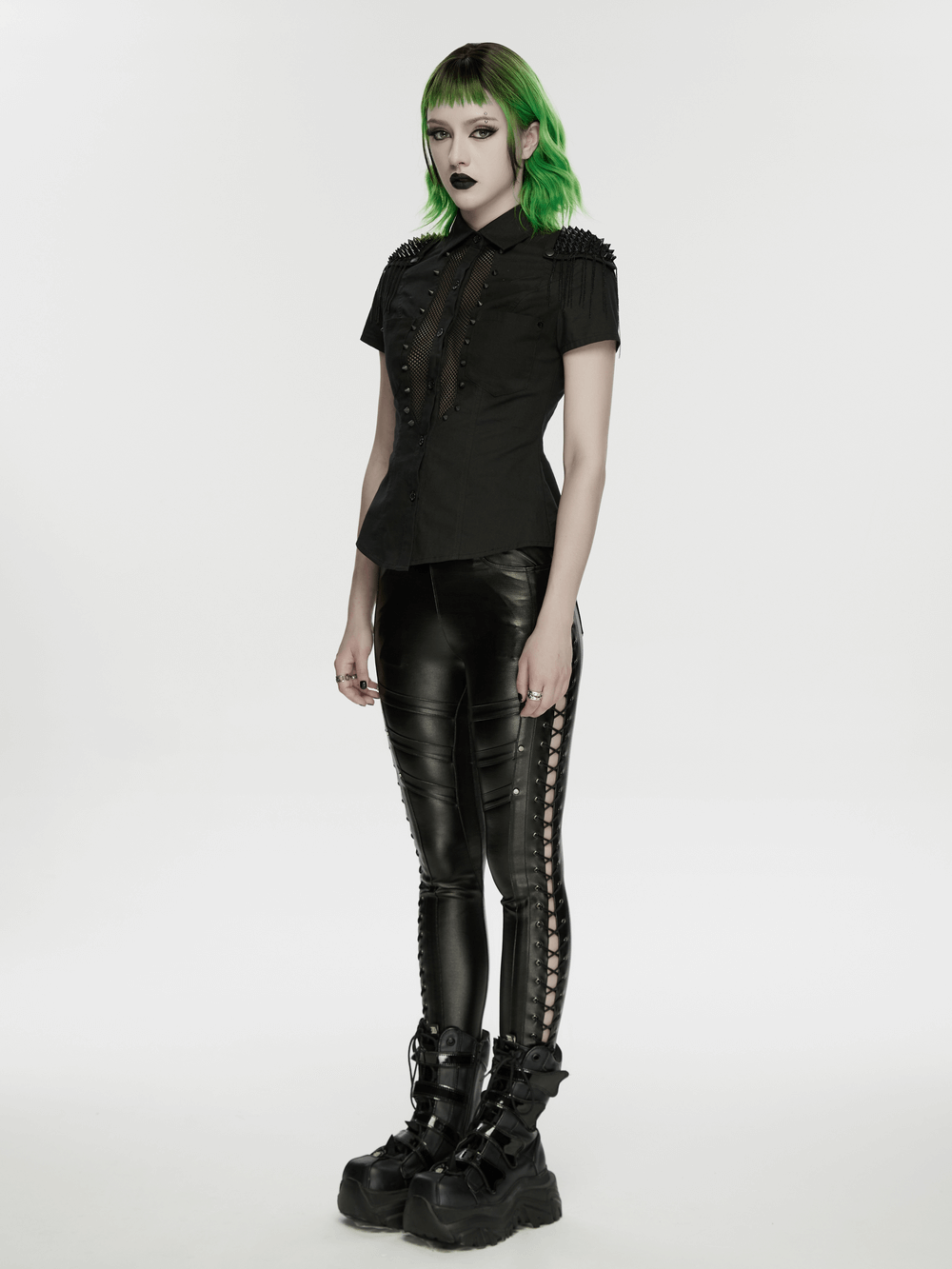 Black Punk Faux Leather Leggings with Side Drawstrings styled with a black shirt and chunky boots.