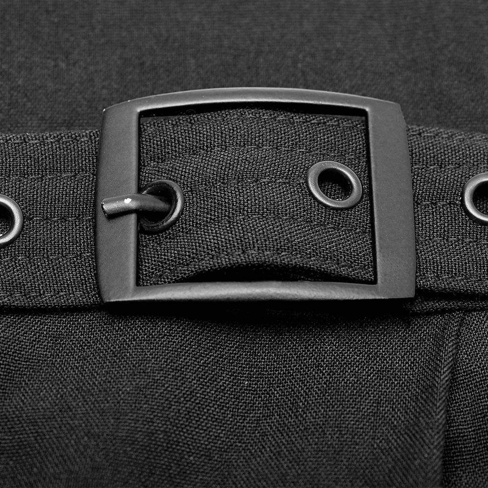 Close-up of a black leather belt buckle on wide-leg pants with metal adjusting buttons.