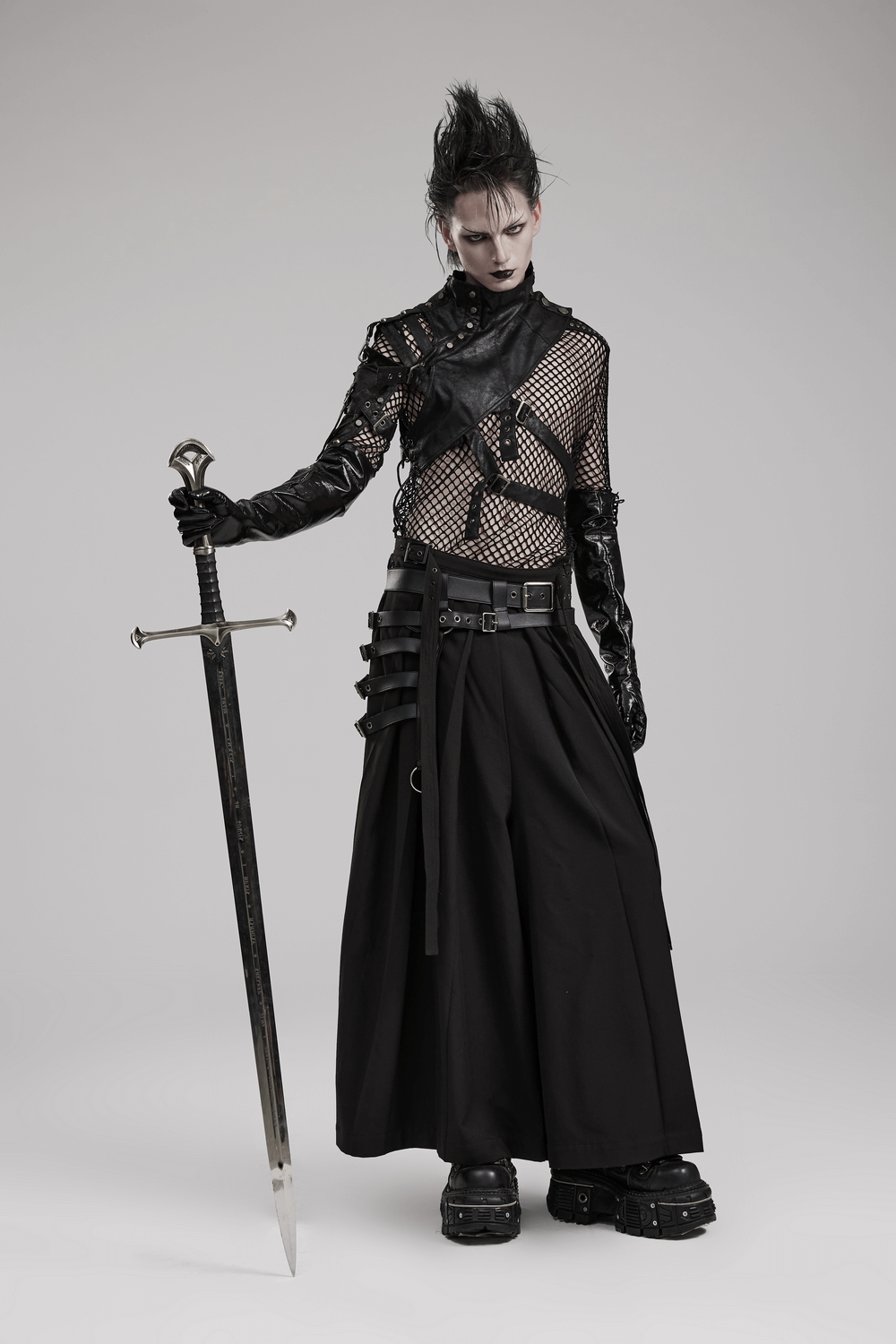 Black punk kimono wide leg pants with buckles, styled with a sword and edgy accessories.