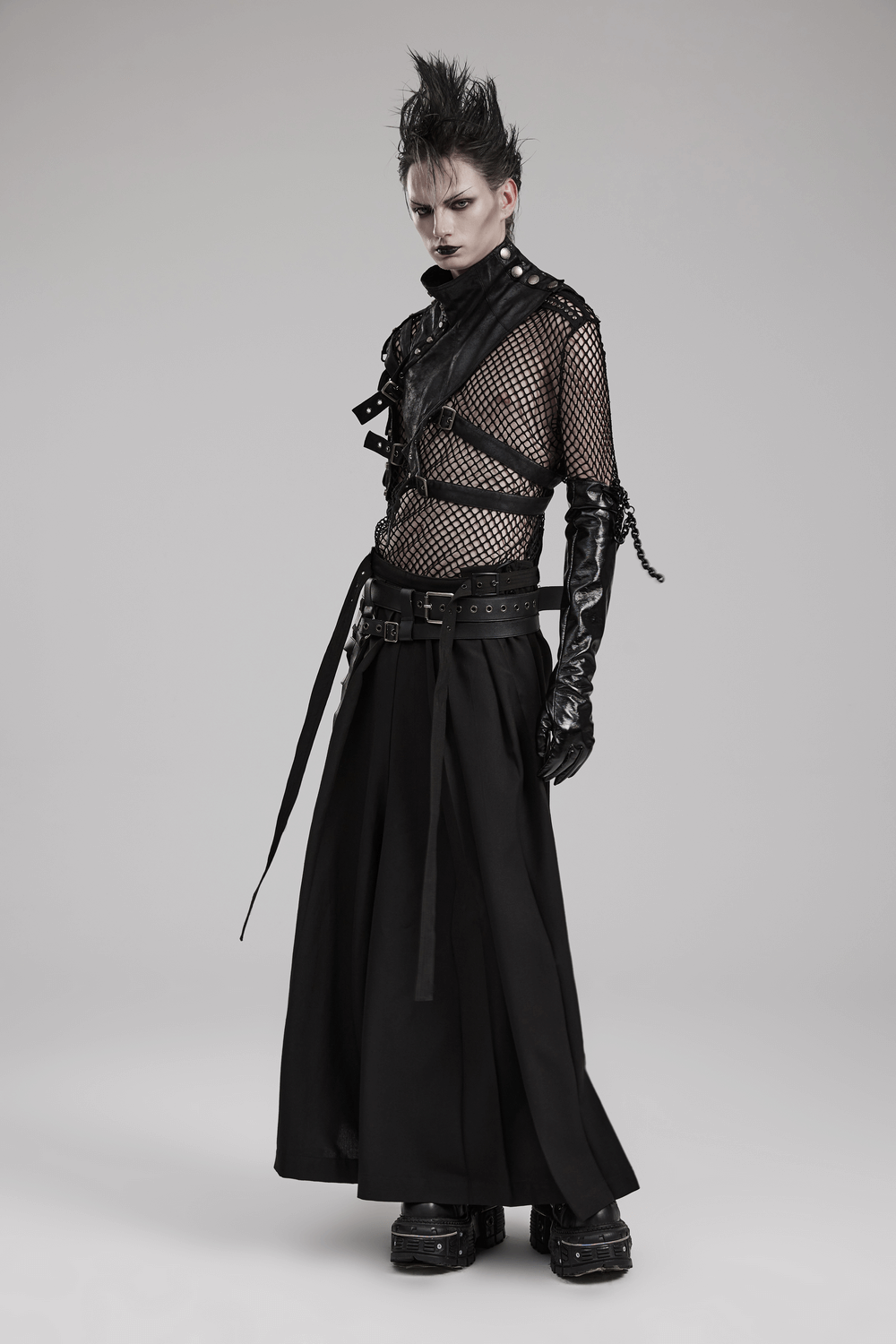 Model wearing black punk kimono wide leg pants with buckles and a mesh top, showcasing a fierce warrior style.