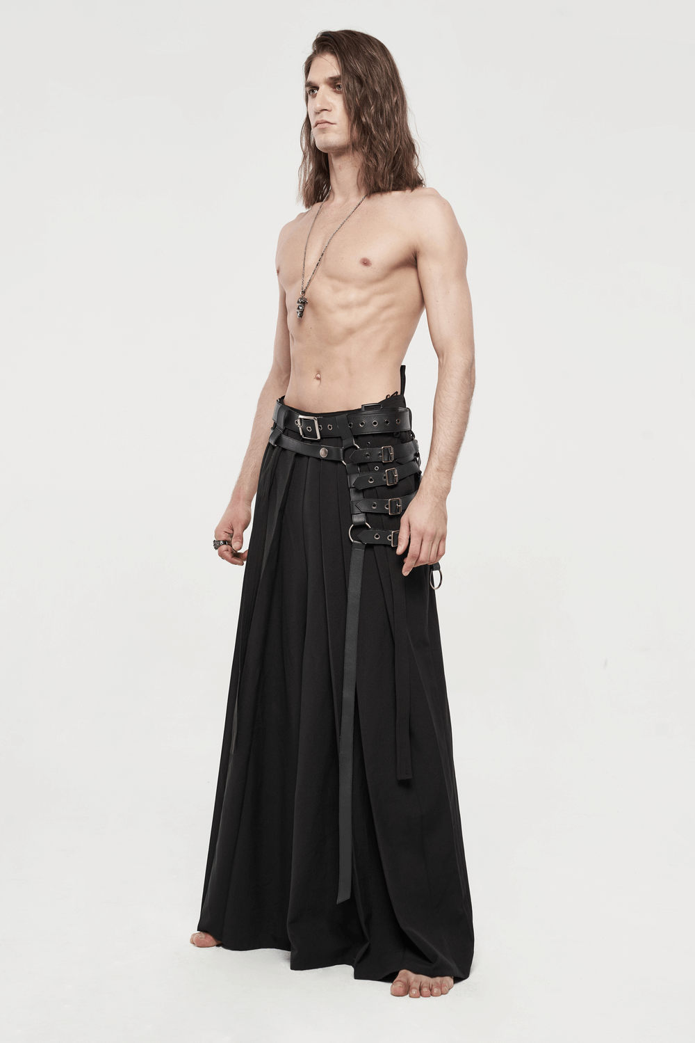 Black punk kimono wide leg pants with buckles worn by a model, showcasing a warrior-inspired style.