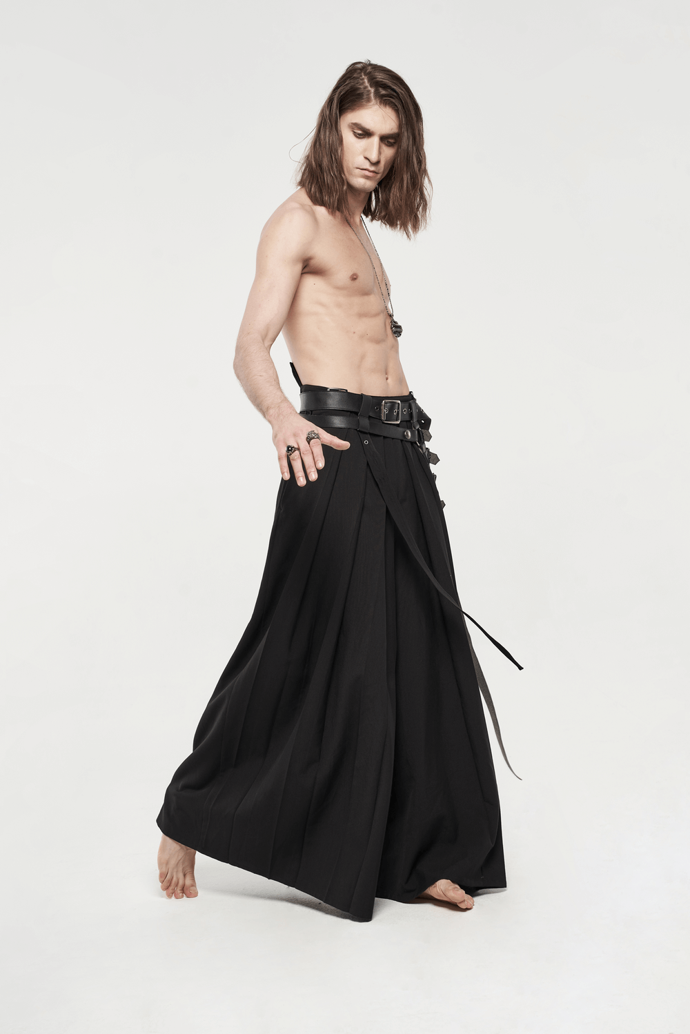 Model wearing black punk kimono wide leg pants with buckles, showcasing their unique samurai-inspired design.