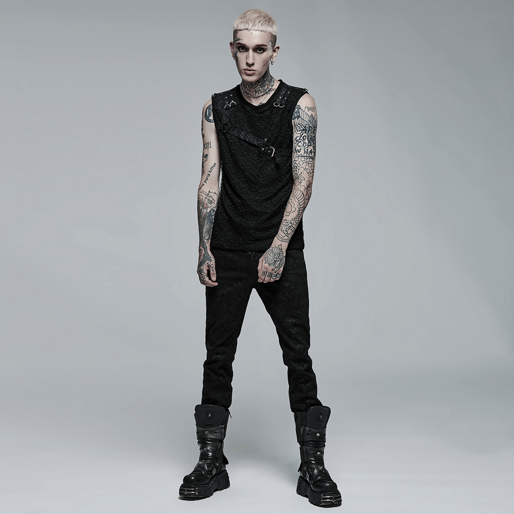 Stylish model in a black punk mesh tank top, showcasing leather accents and bold tattoos, perfect for edgy fashion lovers.