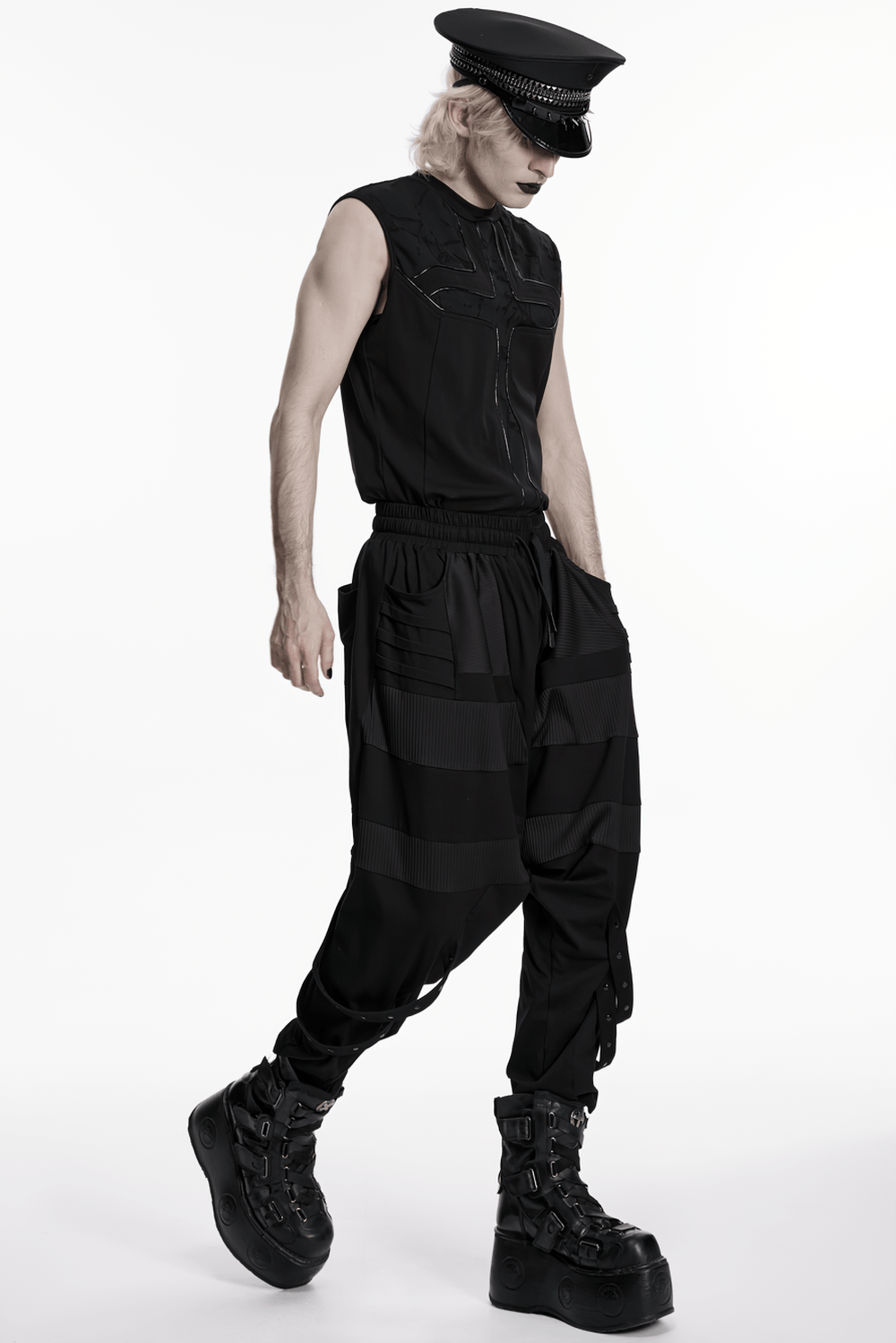 Black Punk Military Cap with Studded Gloss Visor worn with a sleek black outfit featuring baggy cargo pants and chunky boots.