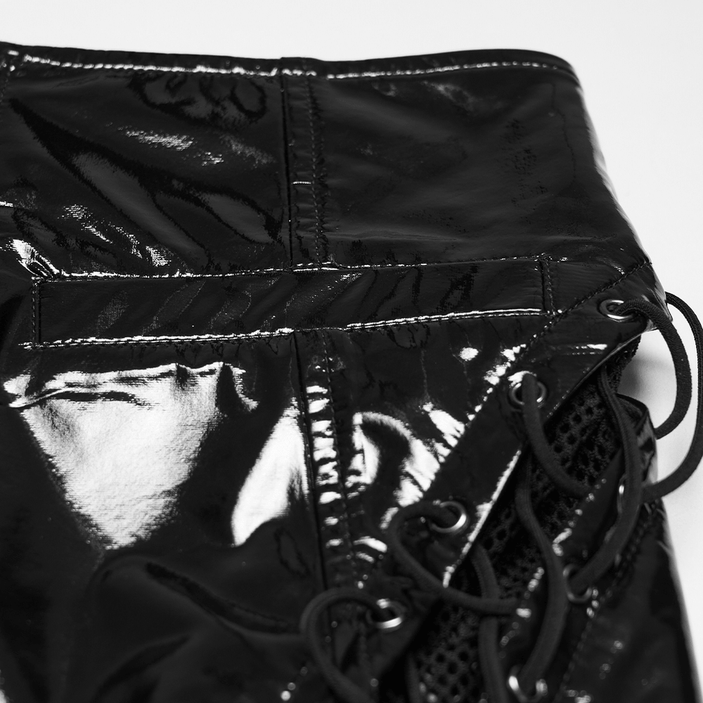 Alt Tag: Black Punk Patent Leather and Mesh Mini Skirt close-up in glossy black patent with eyelets and drawstring lacing detail
