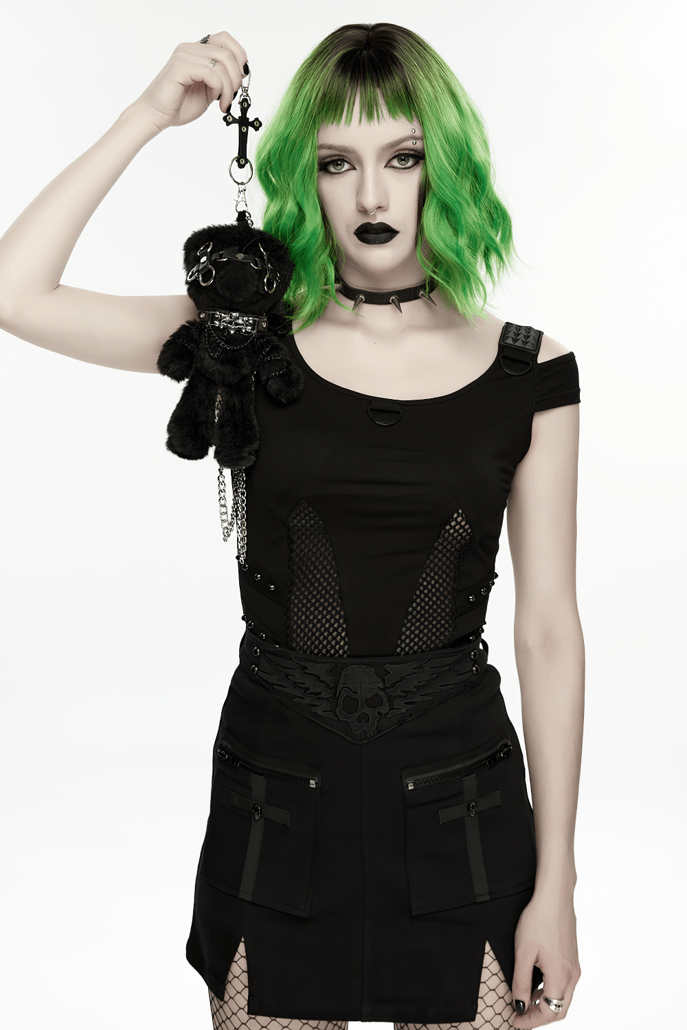Black Punk Rebel Doll Keychain with Faux Fur Charm held by a model with green hair in edgy attire.