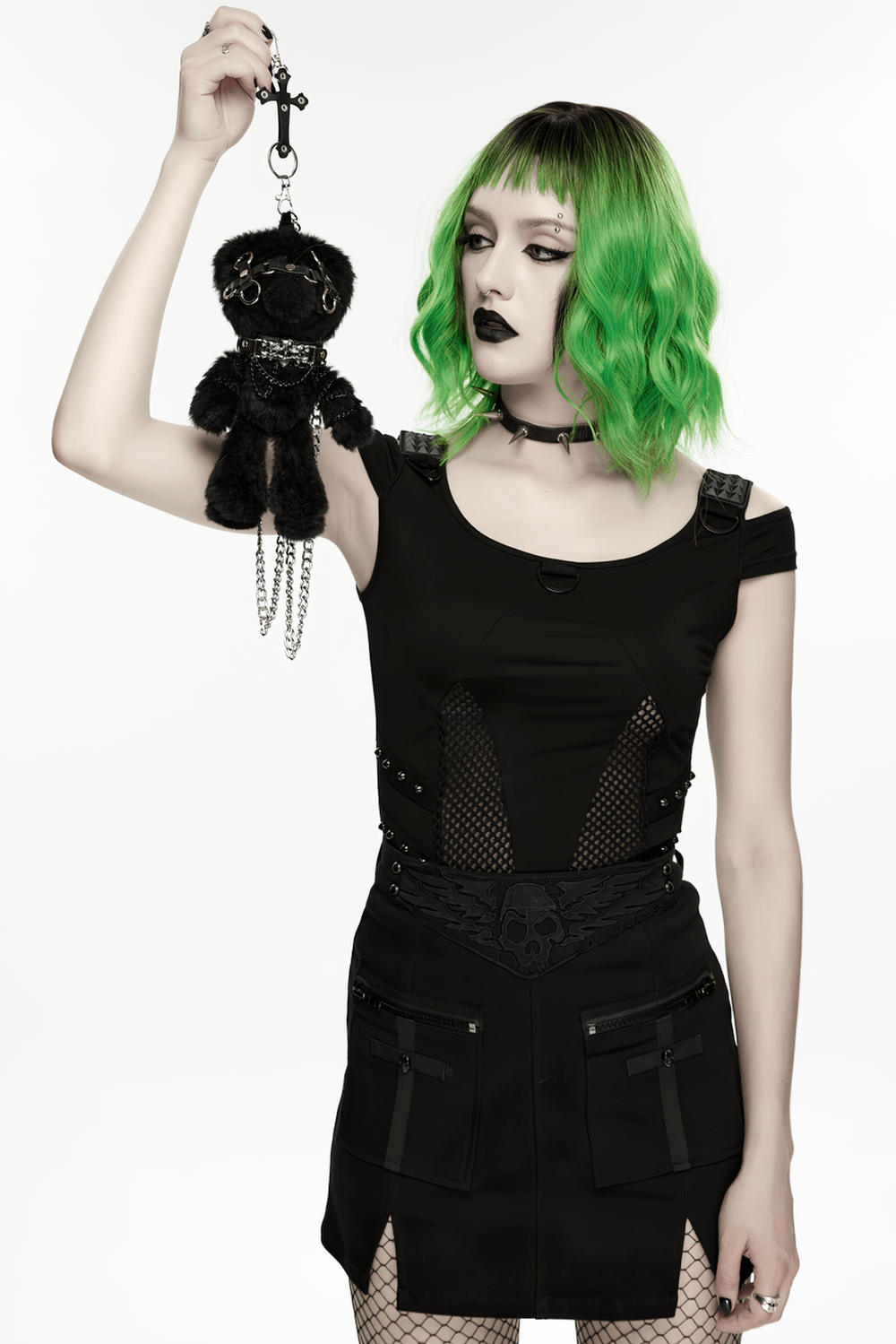 Black Punk Rebel Doll Keychain with Faux Fur Charm held by a model with green hair in a punk outfit.