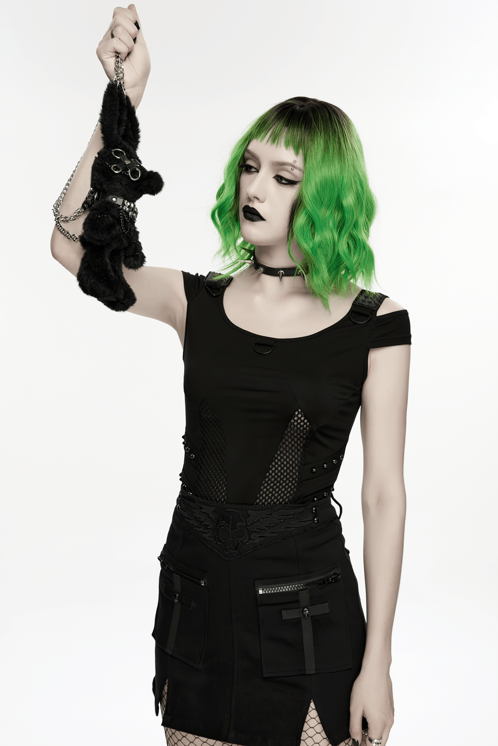 Black Punk Rebel Doll Keychain with Faux Fur Charm held by a model with green hair and black outfit.