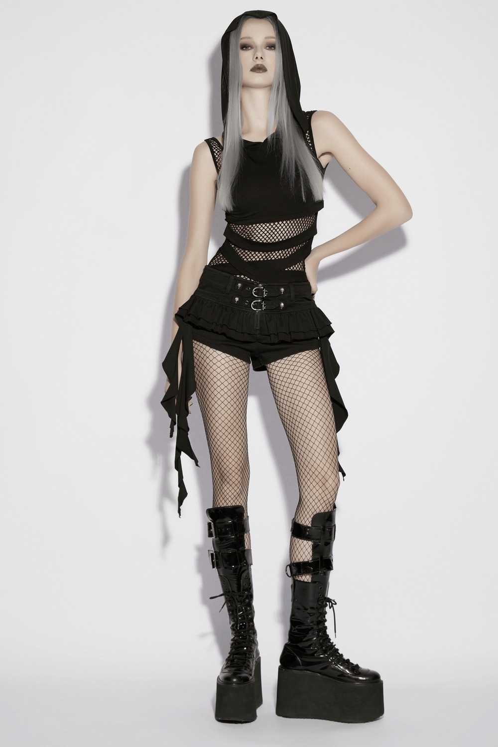 Black Punk Ruffle Buckle Skort with Strap Details worn with mesh and platform boots, showcasing a bold punk fashion statement.