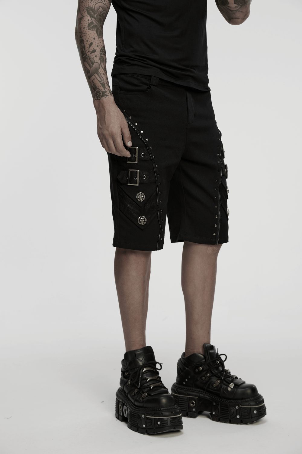 Edgy black punk shorts with armor details, zippers, and skull rivets for a bold alternative style.