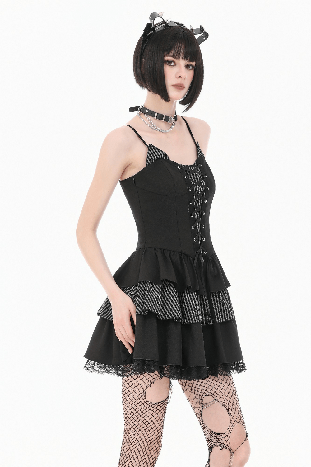 Black Punk Striped Mini Dress with Lace-Up Bodice worn by a model featuring ruffles and a lace-up design.