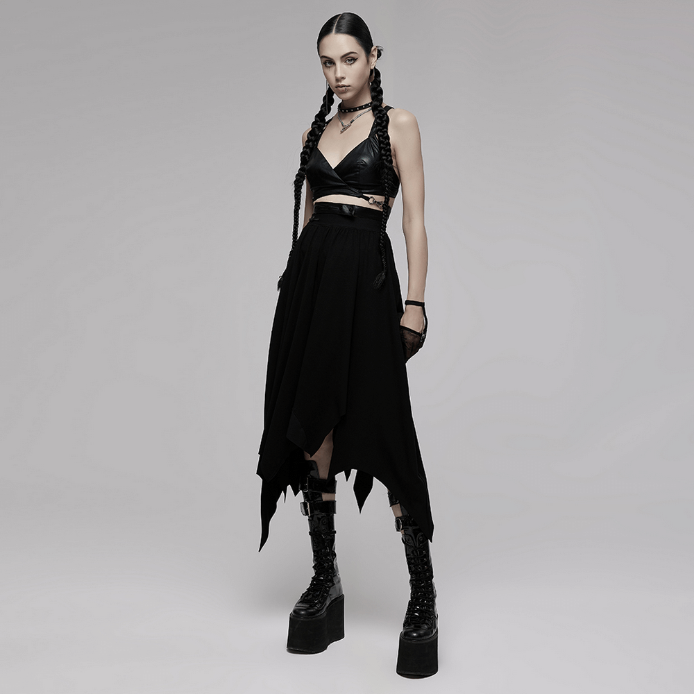 Black punk style crop top with criss-cross back, paired with edgy skirt and platform boots for a bold look.