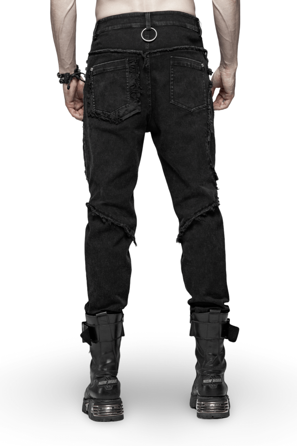 Back view of black punk-style ripped jeans with fishnet layers, featuring a relaxed fit and unique distressed details.