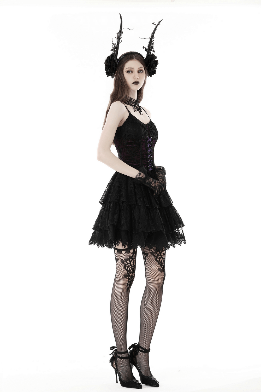 Gothic Lolita model in black and purple lace-up mini dress, showcasing a dark fairy aesthetic with elegant accessories.