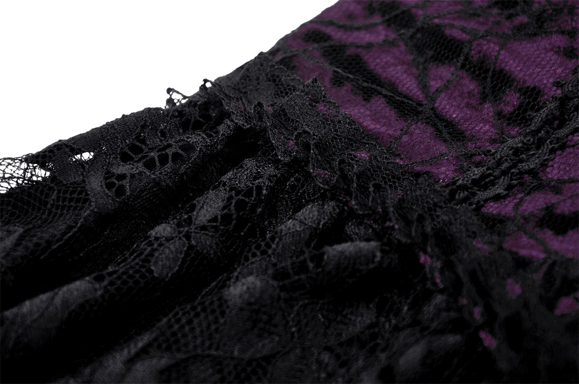 Close-up of black and purple lace detailing on gothic mini dress, showcasing luxurious velvet and intricate lace textures.