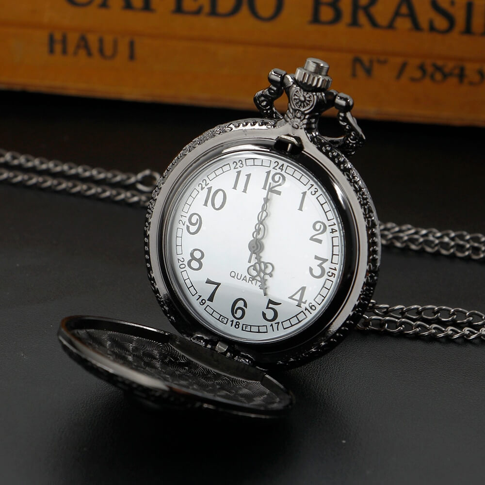 Unisex black quartz pocket chain watch with skull design, showcasing gothic style and precision timekeeping.
