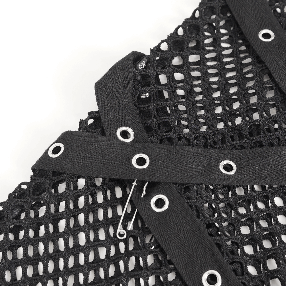Close-up of black mesh fabric with garter straps and metal eyelets for edgy fashion details.