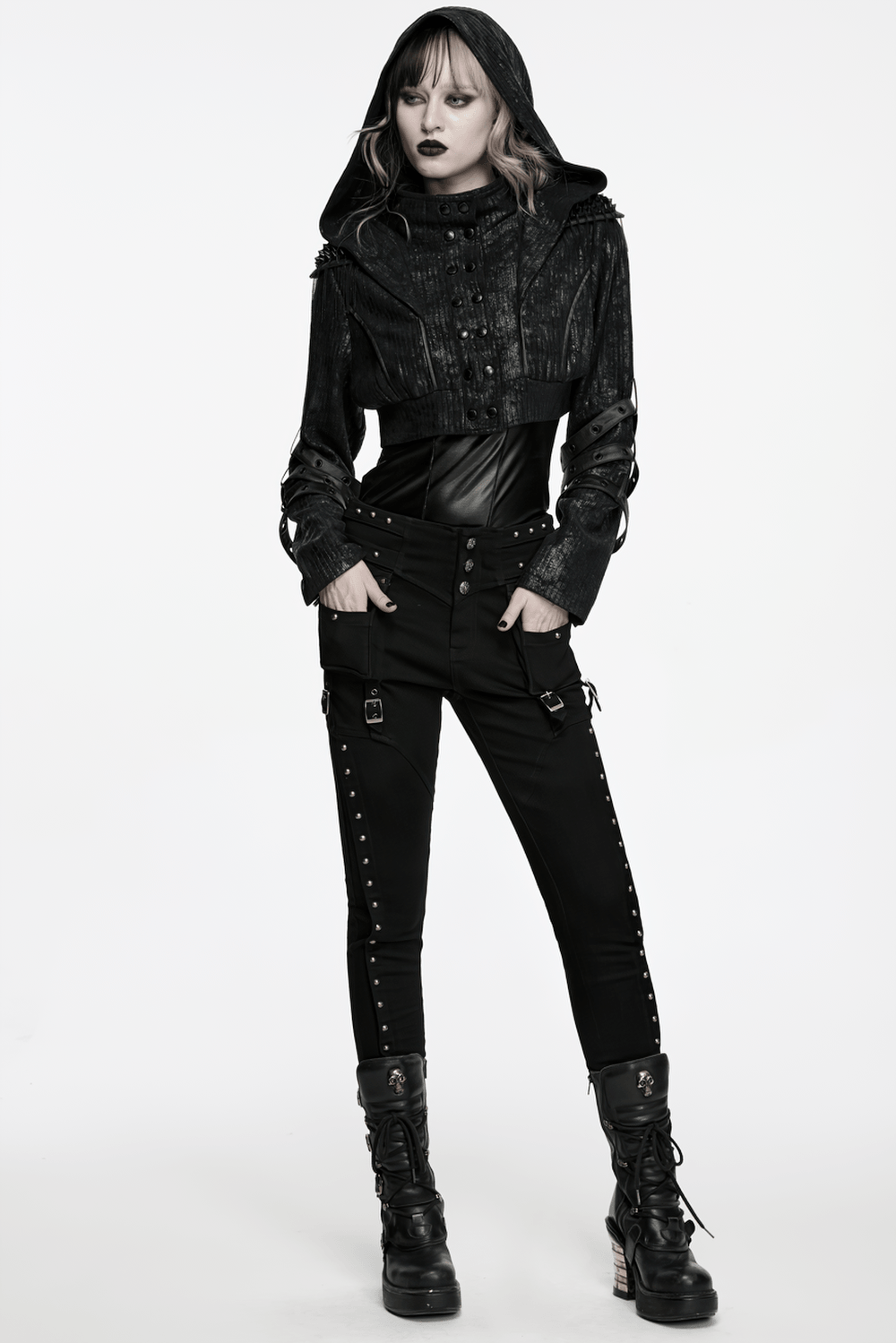 Model showcasing the Black Ribbed Punk Jacket with Hood and Leather Cuffs, styled with statement cargo pants.