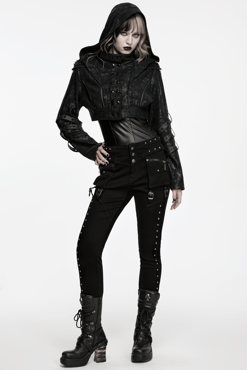 Black Ribbed Punk Jacket with Hood and Leather Cuffs worn with studded pants and boots for a bold punk look.