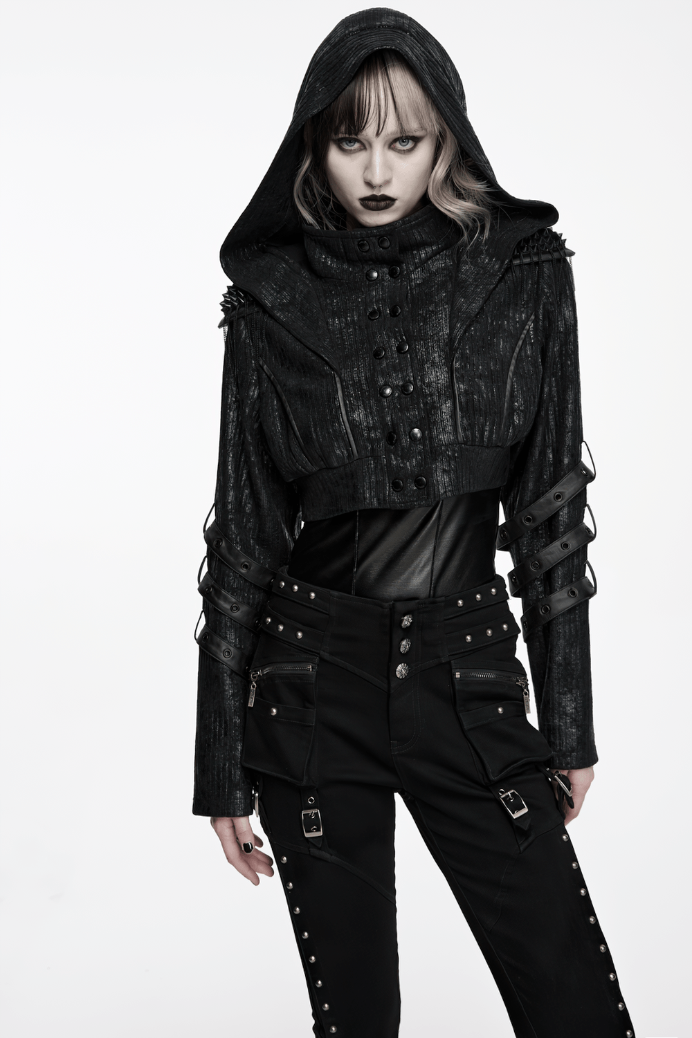 Model wearing Black Ribbed Punk Jacket with Hood and Leather Cuffs, showcasing studded details and a gothic style.