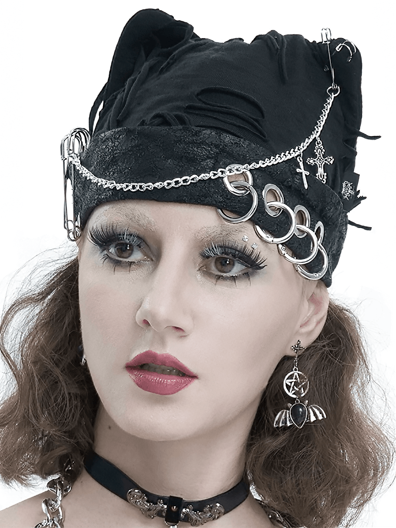 Gothic black cat ear hat with chains and metal pins, styled with edgy punk fashion accessories.