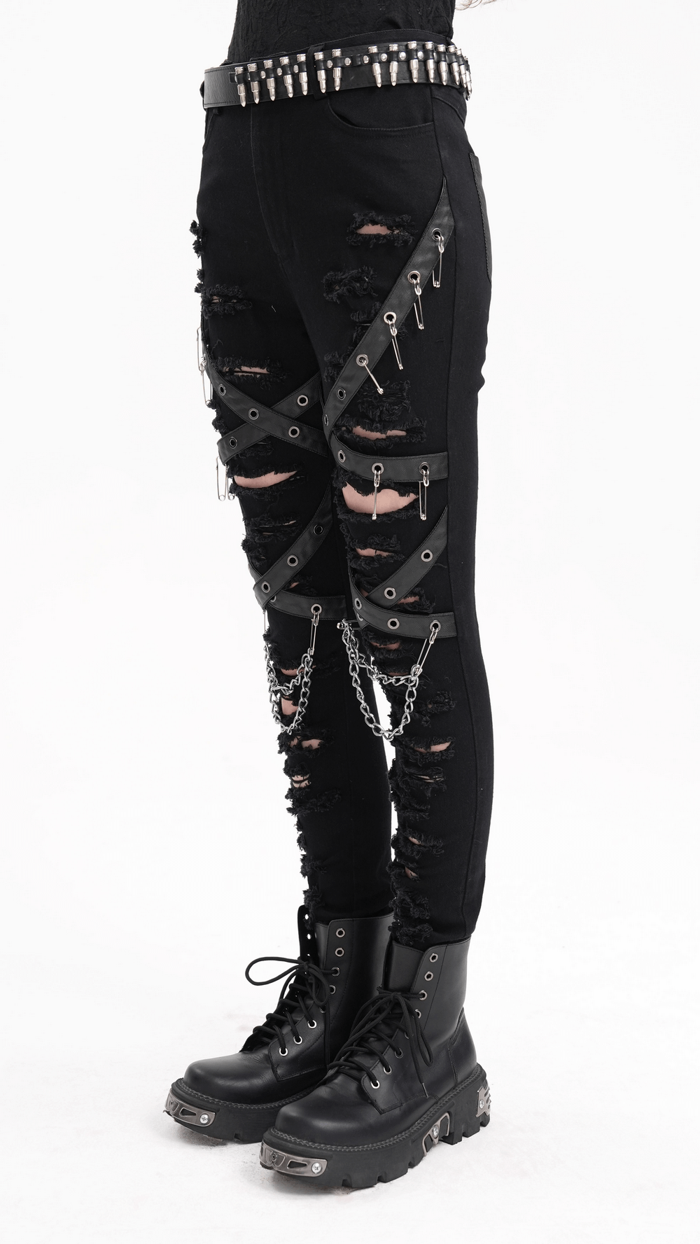 Black ripped skinny jeans with chains and buckles, featuring edgy distressed details for a gothic look. Perfect for alternative style!