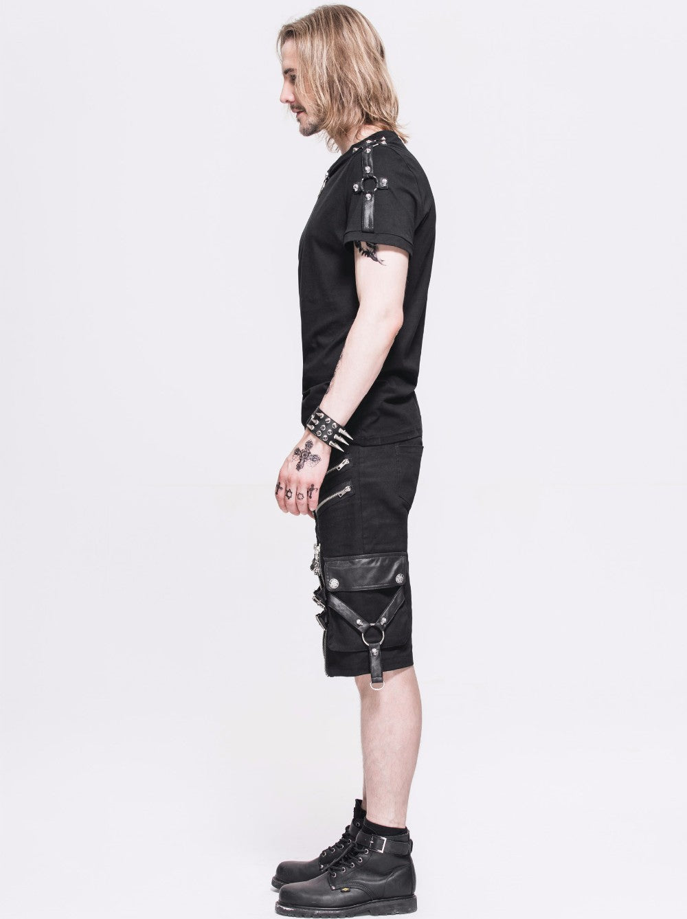 Model wearing black rock style shorts with straps and zippers, showcasing gothic alternative fashion.