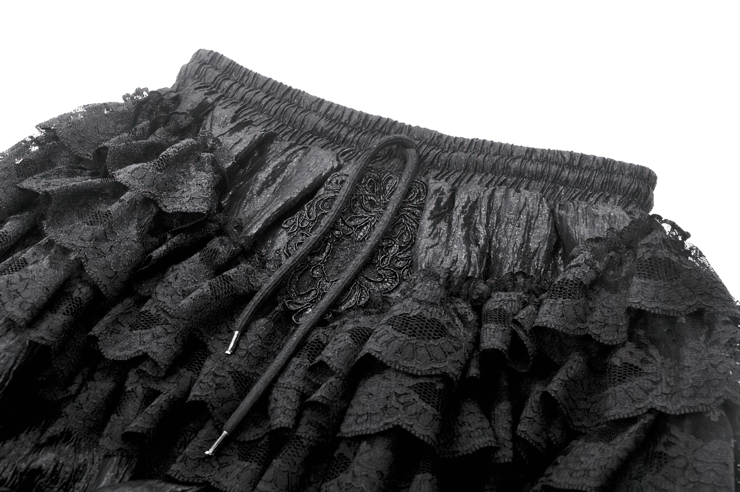 Close-up of black ruffle lace bloomers shorts with satin ribbon ties and layered lace detailing.