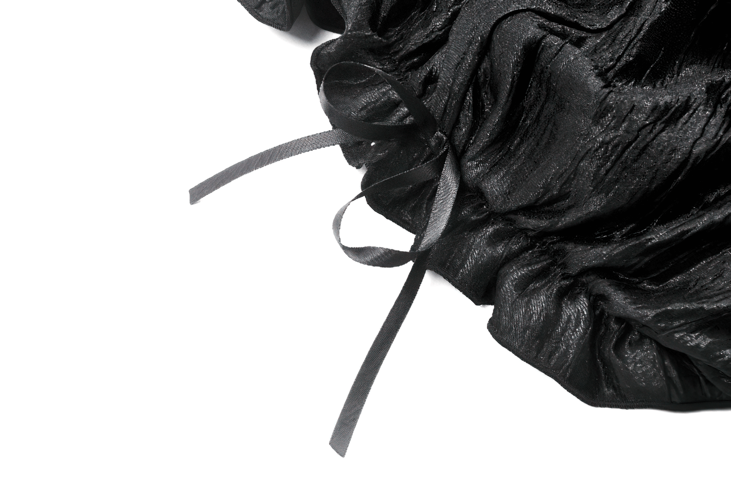 Close-up of black ruffle lace bloomers showcasing silky fabric and delicate tying ribbons detail.
