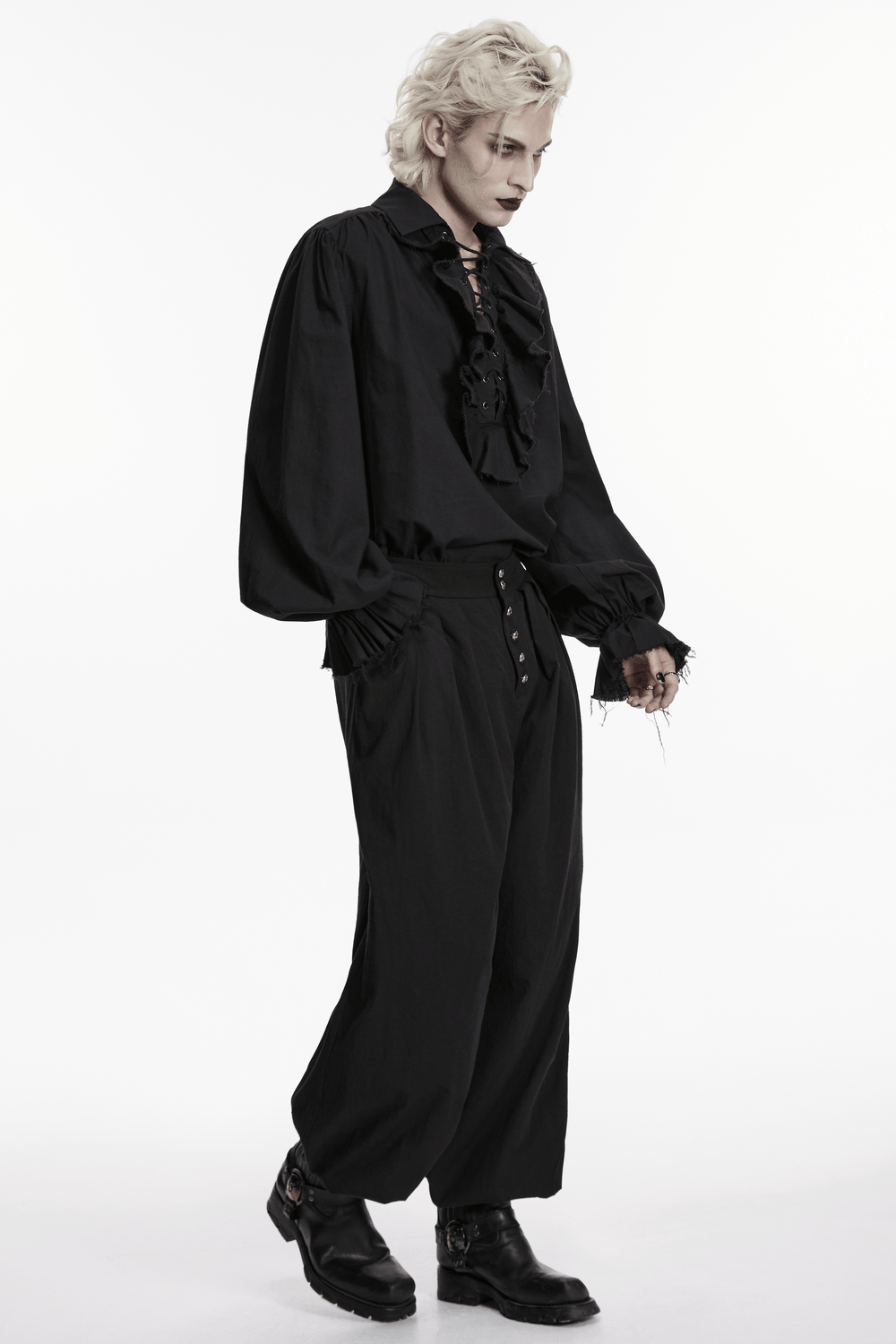Black Ruffle Lace Up Gothic Poet Shirt for Men worn by a model with dramatic styling and dark fashion expression.