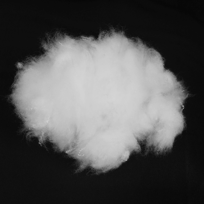 Fluffy white pillow stuffing material, ideal for home decor and craft projects, showcasing soft texture for comfort.