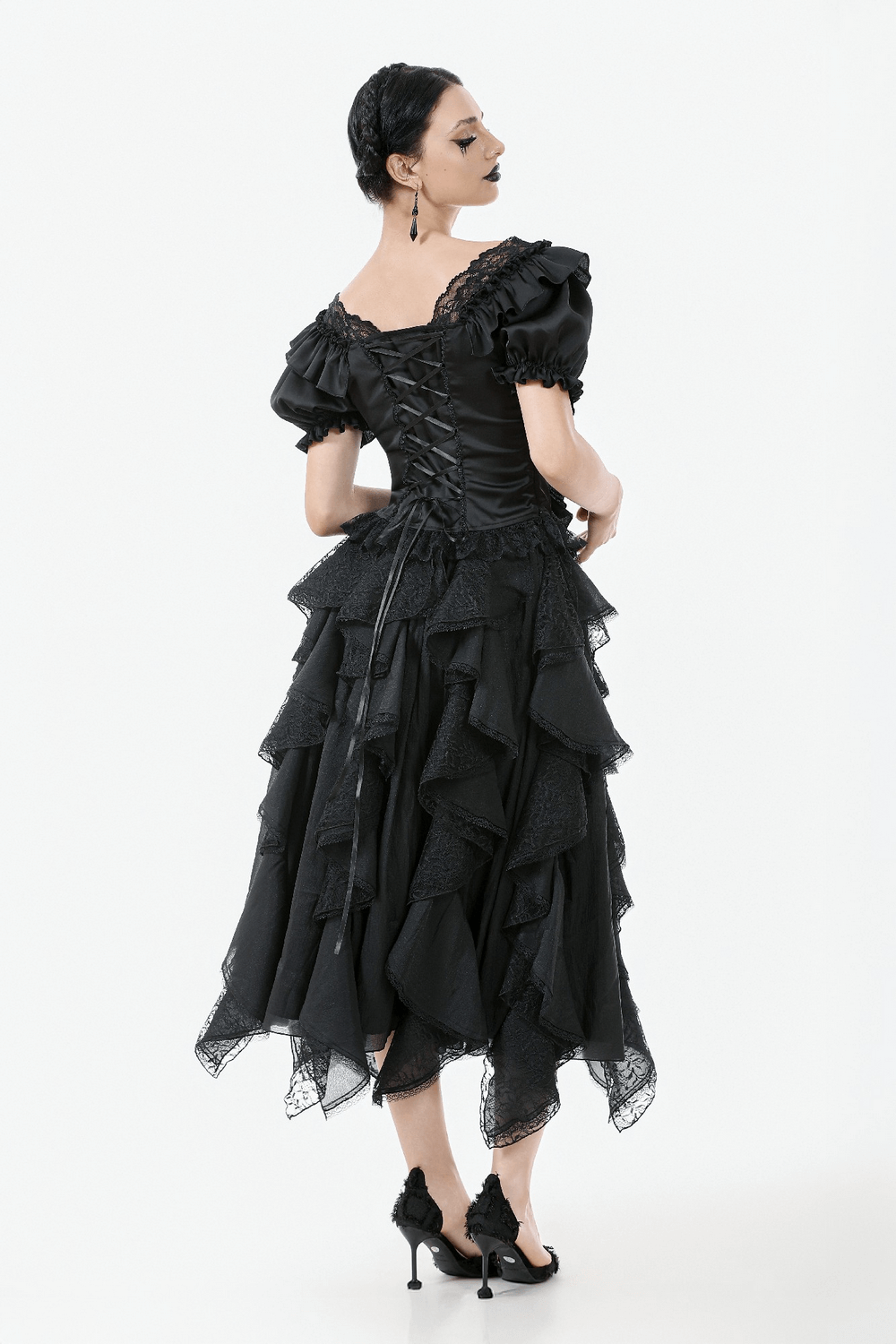 Elegant black satin top with lace ruffles and ribbon detailing, showcasing a Victorian-inspired lace-up back.